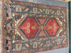 A TURKISH TRIBAL RUG, 172 X 118cm.