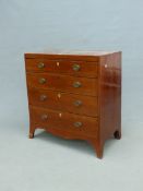 A GEORGE III MAHOGANY CHEST, THE FOUR GRADED DRAWERS INLAID WITH CHEVRON BANDS, THE APRON CURVING