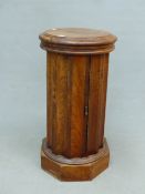 A WALNUT VICTORIAN FLUTED COLUMNAR BEDSIDE TABLE A WASH BASIN WITHIN THE LIFT UP TOP, THE SIDE