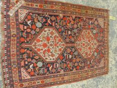 AN ANTIQUE PERSIAN SHIRAZ RUG, 178 X 125cm