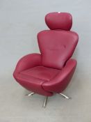 A CASSINA "DODO" K10?RED LEATHER UPHOLSTERED RECLINING ARMCHAIR SWIVELLING ON A CROSS OF FOUR