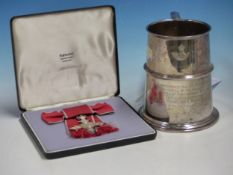 A GEORGE V MBE IN A FATTORINI BOX WITH ITS BOW TOGETHER WITH A 1935 SHEFFIELD SILVER PINT MUG