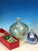 A LANGLEY GLASS COMPRESSED SPHERICAL BOTTLE DECORATED WITH MAUVE TREFOIL LEAVES. H 20cms. A DAVID