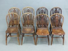 EIGHT WHEEL BACK WINDSOR CHAIRS WITH SADDLE SEATS AND RING TURNED CYLINDRICAL LEGS