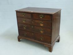 A COUNTRY MADE GEORGIAN OAK FIVE DRAWER CHEST, MOULDED EDGE TOP PIERCED BRASSES, BRACKET FEET, H. 84