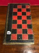 A RED, BLACK AND GILT LEATHER MOUNTED CHESS BOARD DISGUISED AS TWO VOLUMES ON THE HISTORY OF ENGLAND