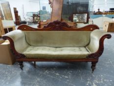 A VICTORIAN MAHOGANY SHOW FRAME SETTEE, THE CENTRE OF THE SERPENTINE TOP RAIL CARVED WITH FOLIAGE