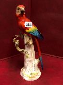 A MEISSEN FIGURE OF A PARROT PERCHED ON A TREE TRUNK, CROSSED SWORDS MARK. H 32cms.
