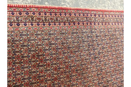 A PERSIAN CARPET OF UNUSUAL DESIGN, 330 X 265cm