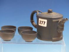 A YIXING BLUE CLAY TEA POT AND FOUR TEA BOWLS, THE FORMER MODELLED AS A SECTION OF BAMBOO, FOUR