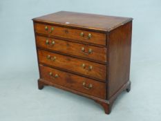 A GEORGE III MAHOGANY CHEST OF FOUR GRADED DRAWERS, EACH WITH EBONY LINED EDGING ABOVE BRACKET FEET.