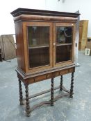 AN ANTIQUE EARLY 18th.C. STYLE WALNUT CABINET ON STAND WITH TWO GLAZED DOORS, SHELVED INTERIOR ON
