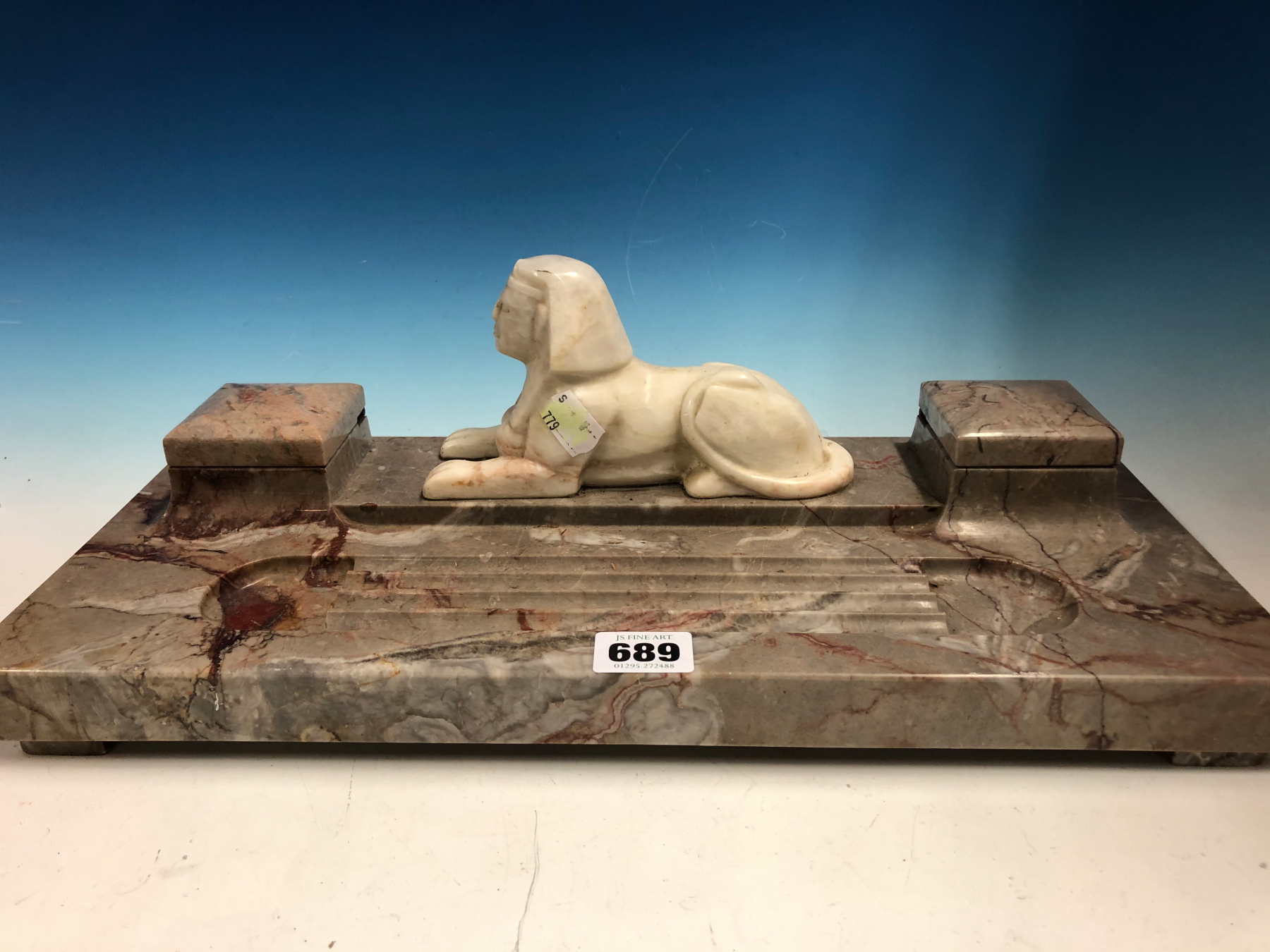 A MOTTLED PINK/GREY MARBLE INKSTAND MOUNTED WITH CENTRAL WHITE MARBLE SPHINX FLANKED BY HINGED