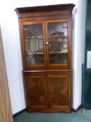 A 19th C. MAHOGANY CORNER CUPBOARD THE UPPER HALF WITH ASTRAGAL GLAZED DOORS OVER SHELVES, THE