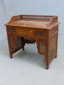 AN EASTERN TASTE WASHSTAND WITH MISHRABIYA THREE QUARTER GALLERY, APRON PANELS AND BRACKETS BELOW