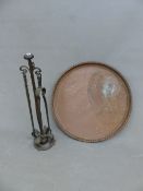 AN ARTS AND CRAFTS BRASS COMPANION STAND, WITH TONGS AND POKER, TOGETHER WITH A LARGE BRASS TRAY.