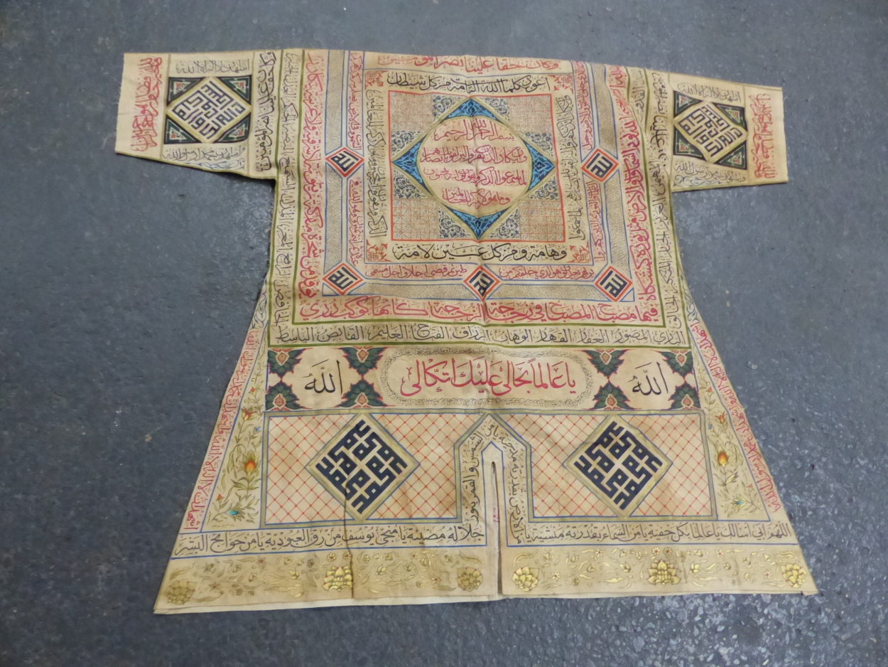 AN ISLAMIC TALISMANIC WHITE LINEN SHIRT WITH PAINTED WITH COLOURED INSCRIPTIONS IN BANDS ABOUT - Image 2 of 3