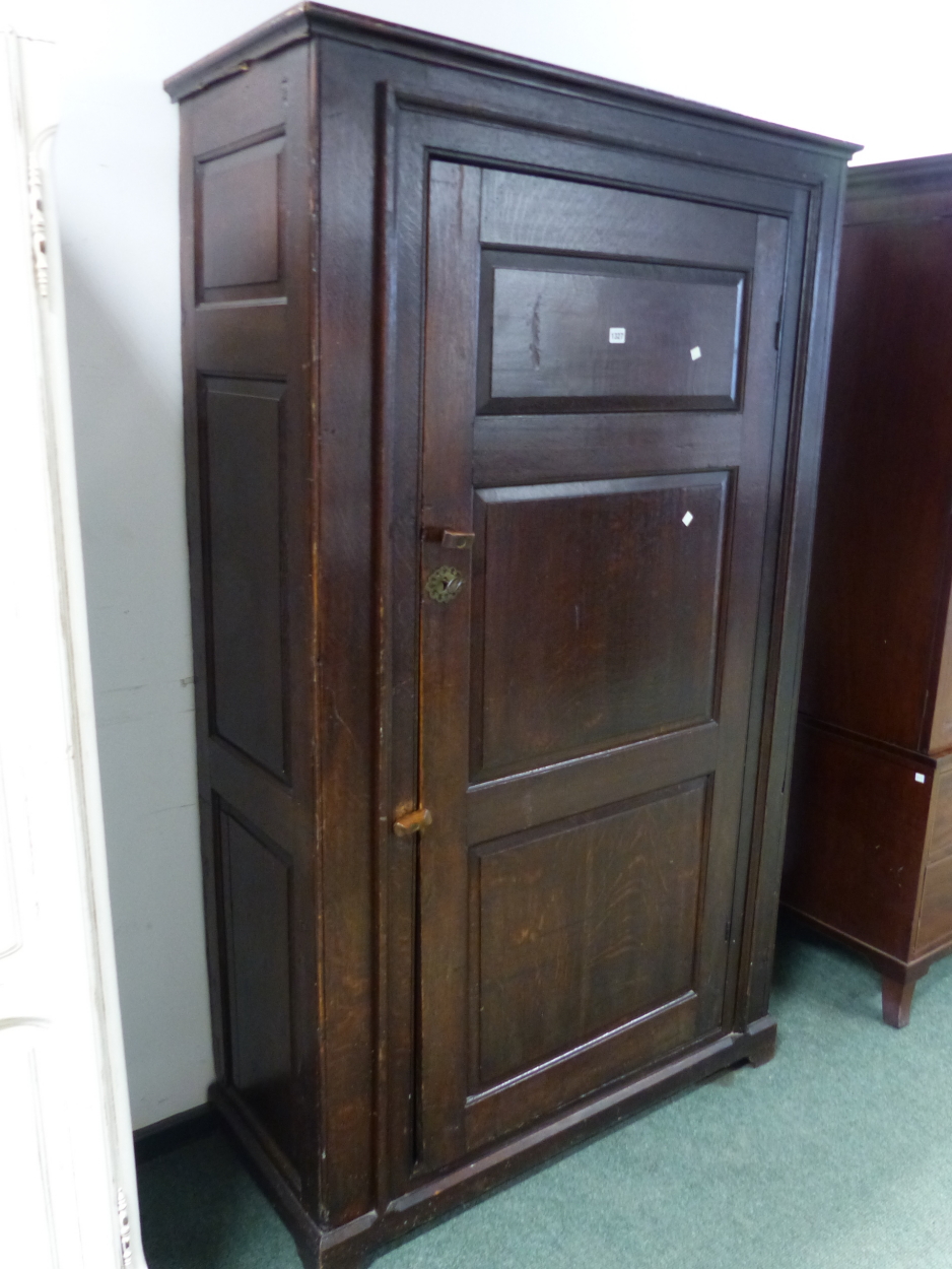 AN 18th C. OAK CUPBOARD WITH THE THREE PANELLED DOOR ENCLOSING HANGING SPACE ABOVE A SHELF AND THE - Image 2 of 10