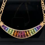 AN 18ct YELLOW GOLD AND RAINBOW GEMSET NECKLACE. THE MULTICOLOURED GRADUATED GEMSTONES IN A CRESCENT
