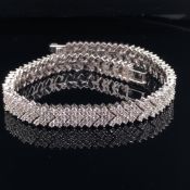 18CT WHITE GOLD AND DIAMOND CHEVRON STYLE ARTICULATED LINE BRACELET, ESTIMATED APPROX DIAMOND WEIGHT