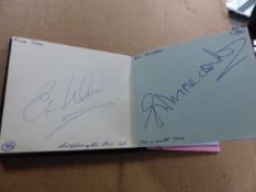 A 1960'S AUTOGRAPH BOOK INCLUDING SIGNATURES OF FOOTBALLERS, THE SHADOWS, DES O'CONNOR, MORECOMBE