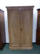 A VICTORIAN MAHOGANY TWO DOOR WARDROBE.