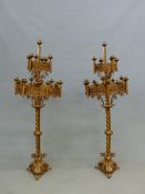 A PAIR OF GILT METAL FLOOR STANDING CANDELABRA, EACH WITH NINETEEN CANDLE NOZZLES ARRANGED IN