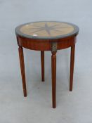 A ROSEWOOD ROUND TABLE INLAID WITH AN EIGHT POINT STAR AGAINST A QUARTERED BLOND ELM ROUNDEL ABOVE