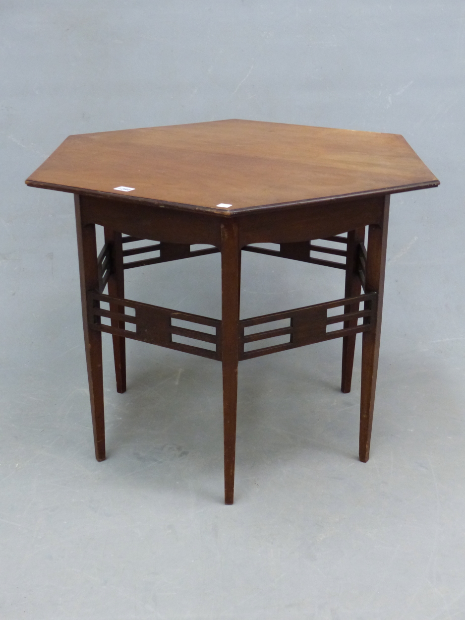 AN ARTS AND CRAFTS MAHOGANY HEXAGONAL TABLE, THE TAPERING SQUARE LEGS JOINED BY THREE BAR STRETCHERS