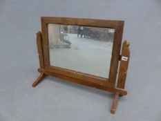 AN OAK FRAMED SWING MIRROR IN THE ARTS AND CRAFTS MANNER, TOGETHER WITH A DRYAD WICKER SEWING BOX