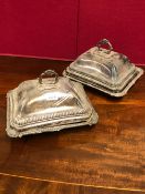 A PAIR OF OLD SHEFFIELD PLATE VEGETABLE TUREENS AND COVERS, EACH WITH GADROONED BANDS THE BASES WITH
