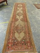 AN ANTIQUE PERSIAN SERAB RUNNER, 424 X 108cm.