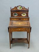 A LATE VICTORIAN MARQUETRY INLAID ROSEWOOD BUREAU, THE SHELVES RECESSED BEHIND THE FALL INSET WITH