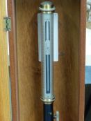 A MAHOGANY CASED NEGRETTI AND ZAMBRA M/6990 MARINE STICK BAROMETER, THE SILVERED SCALE AT THE TOP OF