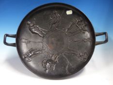 AN IRON TWO HANDLED TAZZA, THE INTERIOR CAST WITH CLASSICAL FIGURES IN THE STYLE OF WEDGWOODS