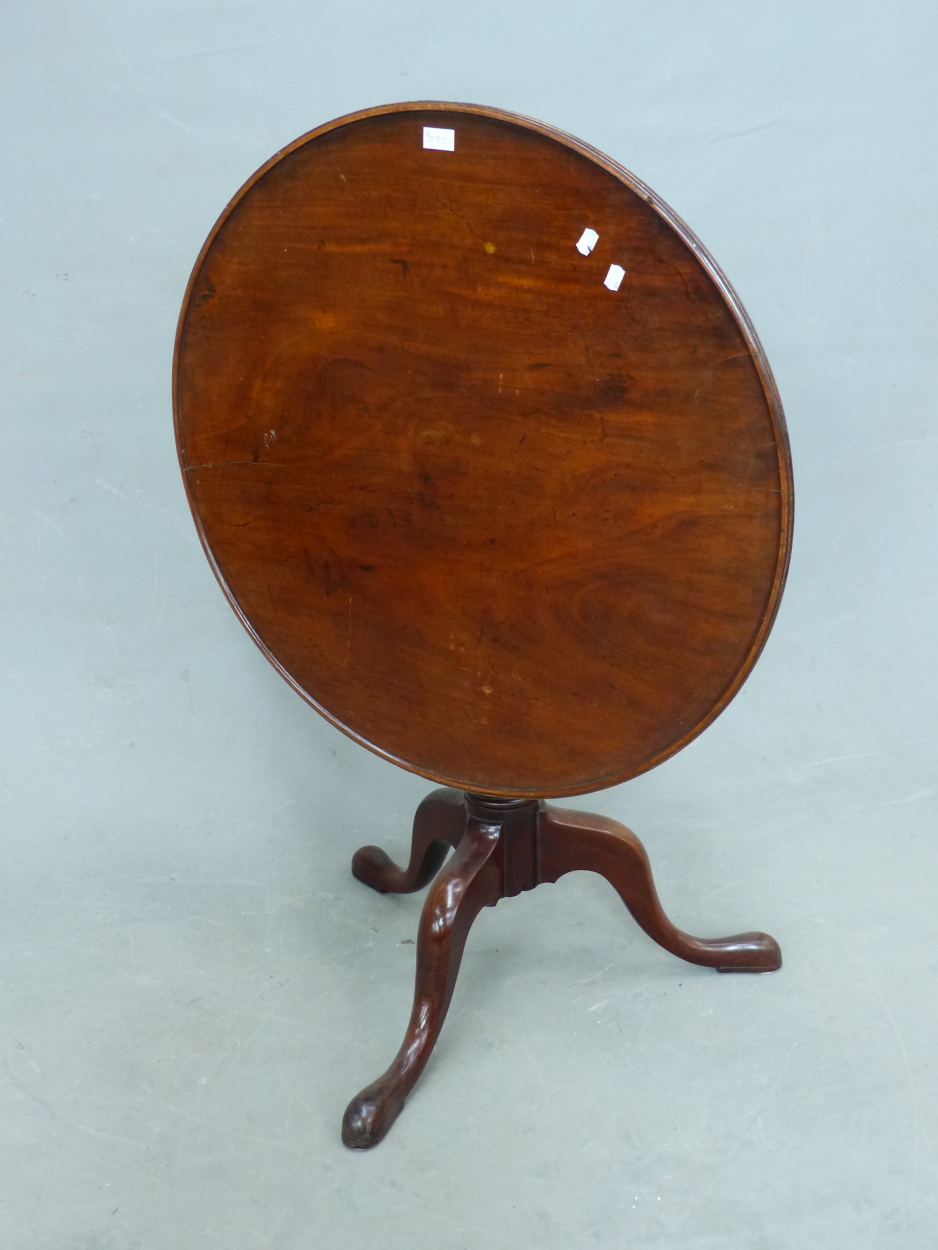 AN ANTIQUE MAHOGANY BIRD CAGE TRIPOD TABLE, THE DISHED CIRCULAR TOP ON BALUSTER COLUMN, THE THREE - Image 2 of 2