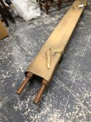 A VINTAGE MILITARY STRETCHER.