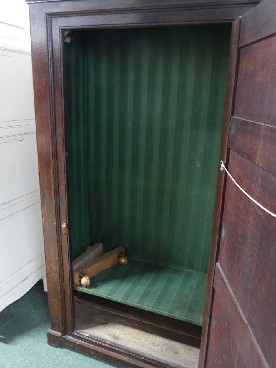AN 18th C. OAK CUPBOARD WITH THE THREE PANELLED DOOR ENCLOSING HANGING SPACE ABOVE A SHELF AND THE - Image 9 of 10