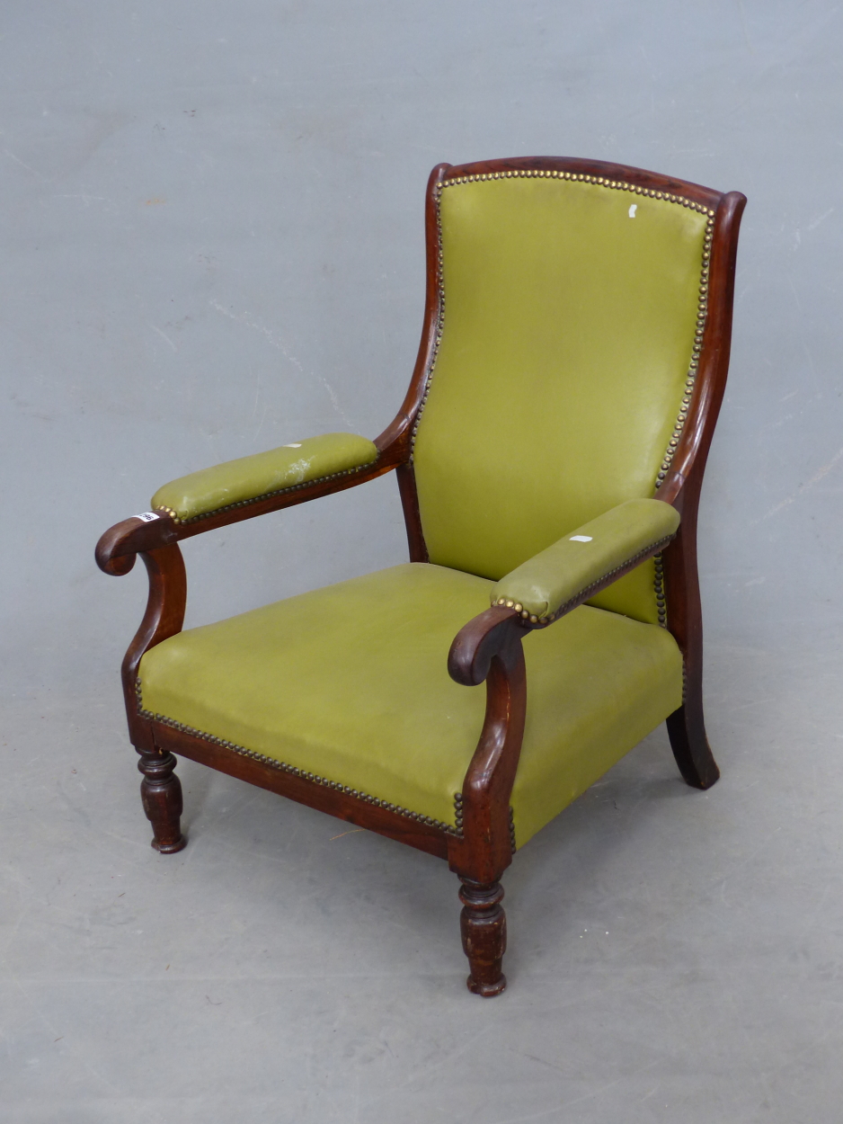 A GREEN LEATHER UPHOLSTERED LOW ARMCHAIR
