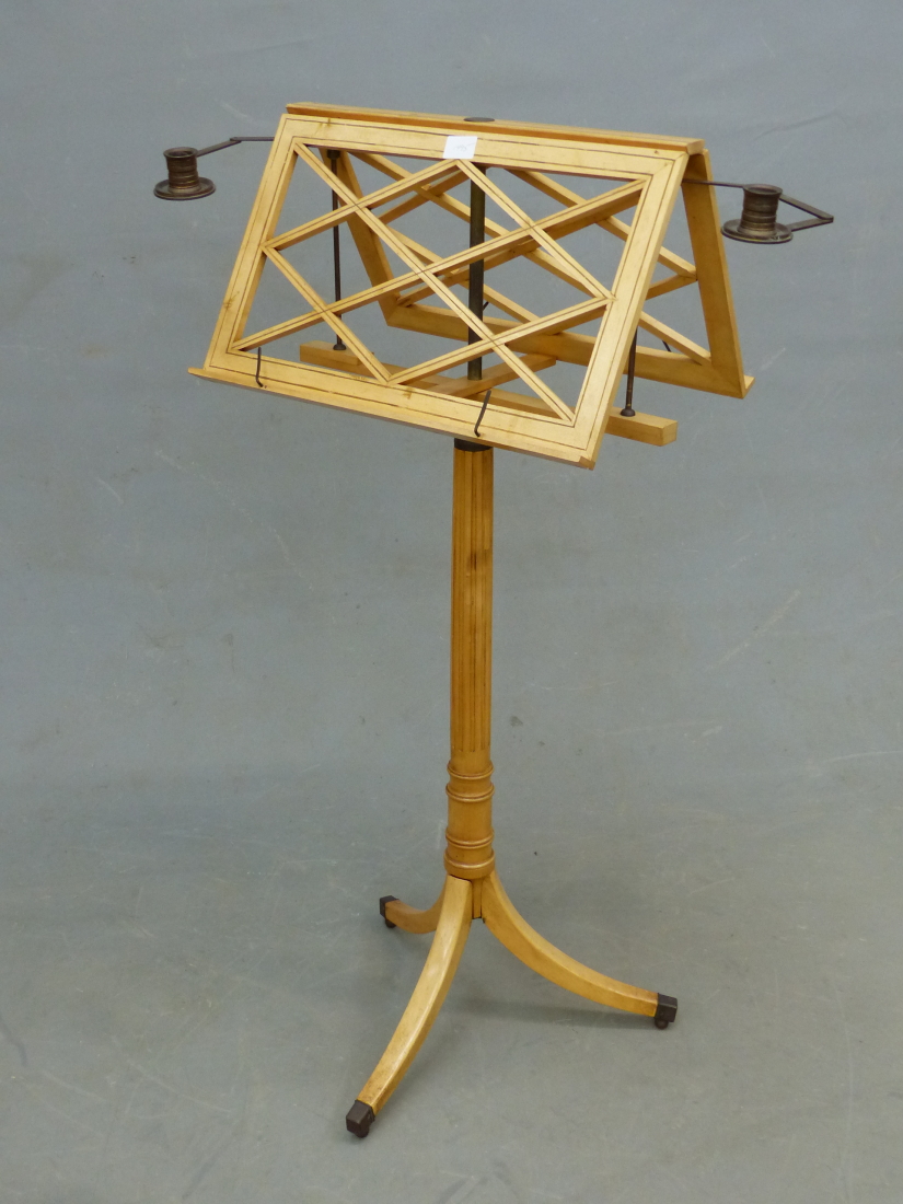 A REGENCY STYLE ADJUSTABLE DUET MUSIC STAND WITH TWIN CANDLE SCONCES.