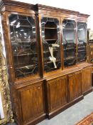 A GEORGE III MAHOGANY BREAKFRONT BOOKCASE, THE FOUR DOORS TO THE TOP ASTRAGAL GLAZED OVER SHELVES, T