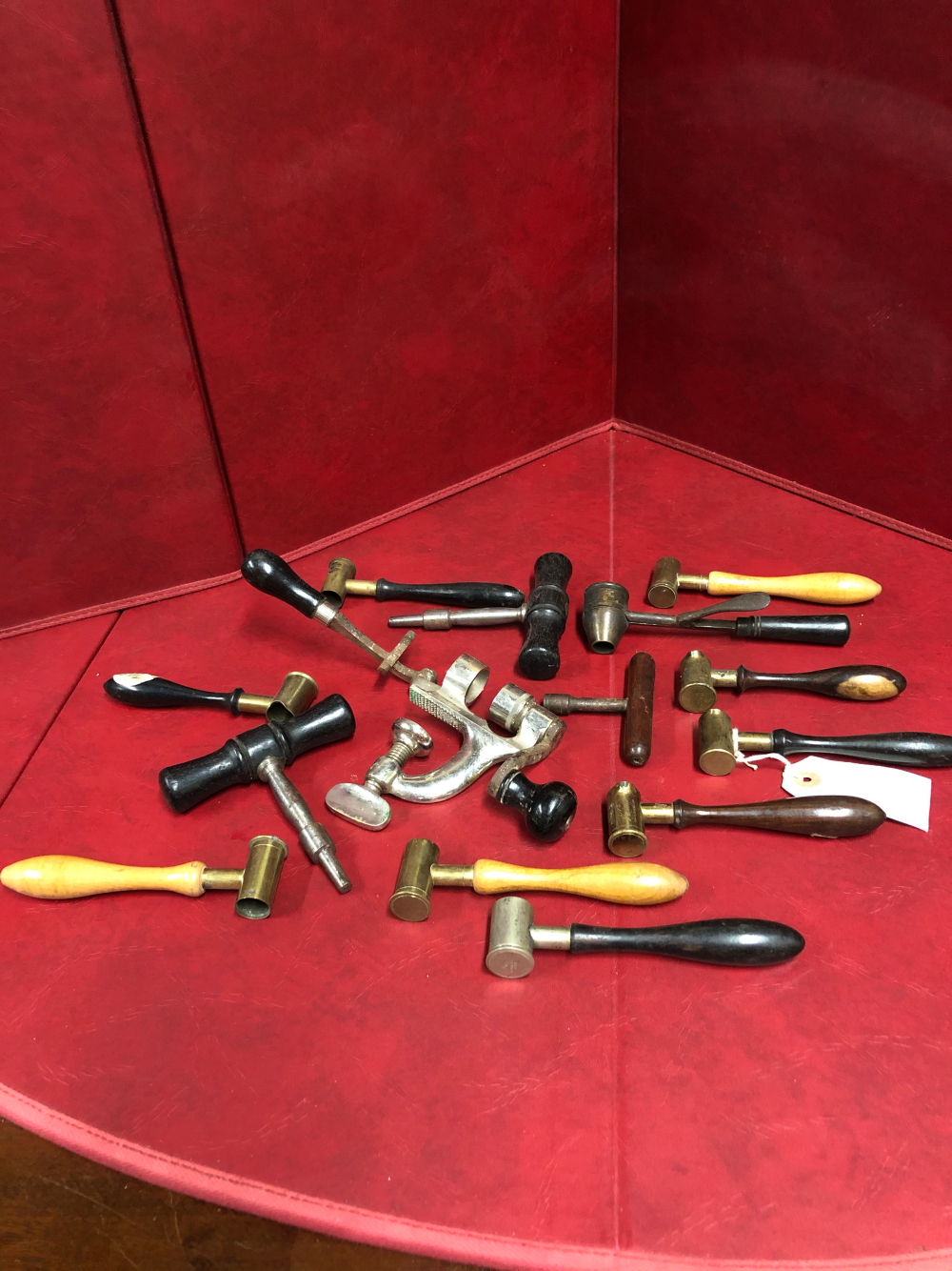 A COLLECTION OF SHOTGUN CARTRIDGE MAKING TOOLS, MEASURES AND A CLAMP