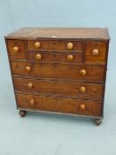 A 19th C. TEAK CAMPAIGN CHEST, THE CONFIGURATION OF SEVEN DRAWERS EACH WITH BLOND WOOD KNOB HANDLES,