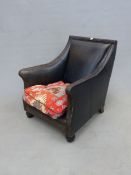 A LEATHER CLUB ARMCHAIR WITH TAPESTRY CUSHION.