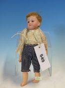 A KESTNER AND REINHARDT SIMON AND HALBIG 117/4 BISQUE HEADED BOY DOLL WITH CLOSED MOUTH AND OPEN AND