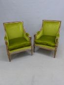 A PAIR OF LOUIS XVI STYLE FRENCH SHOW FRAME ARMCHAIRS, THE CHANNELLED SQUARE BACKS, DOWNSWEPT ARMS