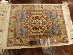 A TURKISH HEREKE SILK MAT, 45 X 34cm.