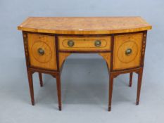 AN INLAID GEORGIAN AND LATER SATINWOOD BOW FRONT SIDEBOARD, THE CENTRAL DRAWER FLANKED BY CUPBOARD