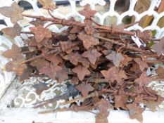 A SET OF WROUGHT IRON GARDEN BORDER PINS, EACH WITH IVY LEAVES ARRANGED ABOUT SPIRAL TWIST