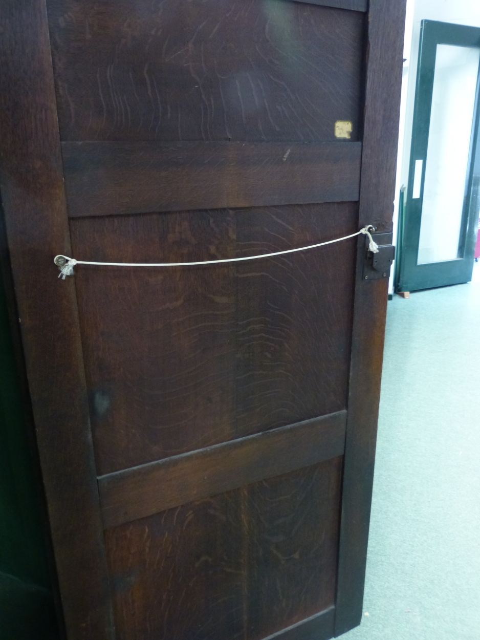 AN 18th C. OAK CUPBOARD WITH THE THREE PANELLED DOOR ENCLOSING HANGING SPACE ABOVE A SHELF AND THE - Image 8 of 10